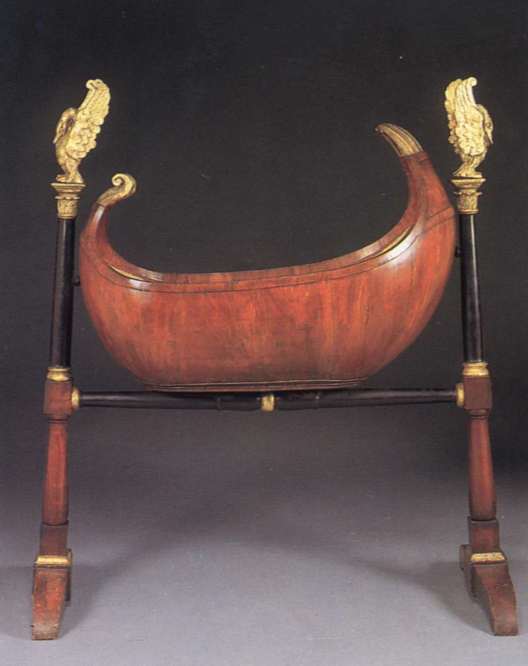 19th Century AUSTRIAN, Biedermeier Black Walnut, Ebonized and Parcel-Gilt Cradle, 1800-1825
Mixed woods, 59 1/2 x 49 1/4 x 20 1/2 in. (151.1 x 125.1 x 52.1 cm)
Rocking crib raised on ebonized columnar supports with corinthian capitals supporting later giltwood swans, the supports joined by a baluster-shaped stretcher ending in trestle legs.
BIE-003-FU
$12,000